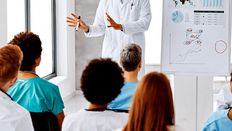 White Coat teaching students