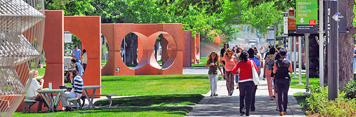 Campus with people walking in summer