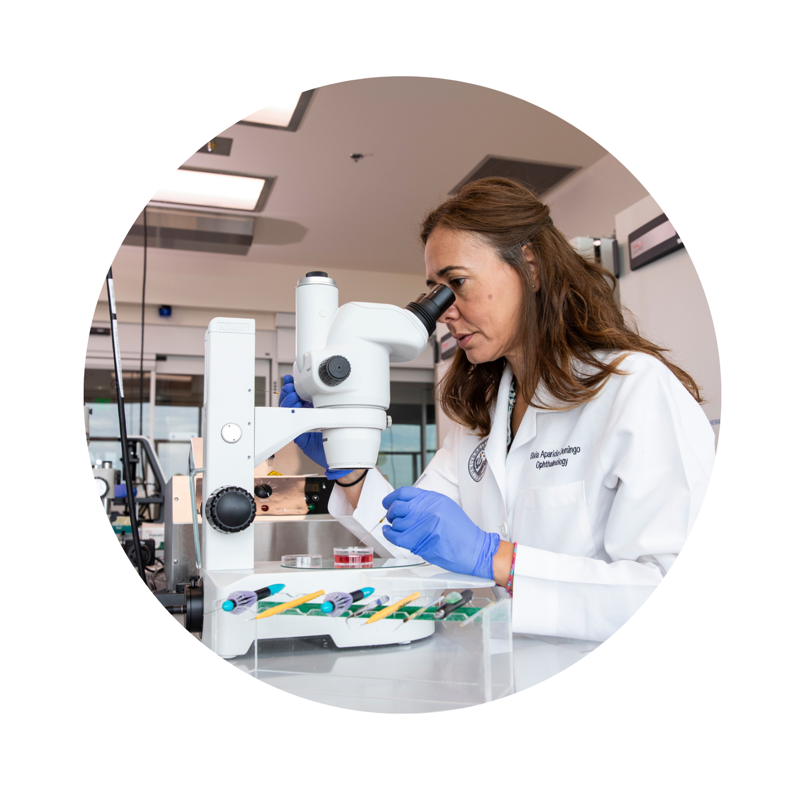 Woman looking through microscope