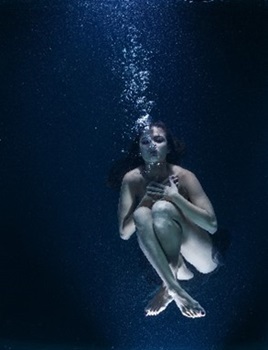 Naked woman underwater
