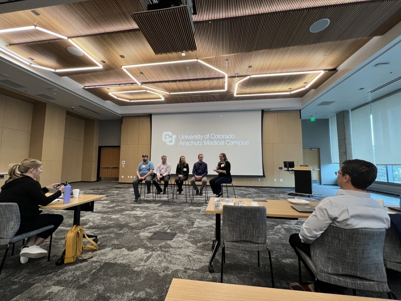 Picture of panelists sitting in front of room