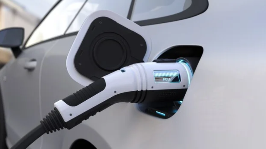 Charger plugged into electric vehicle