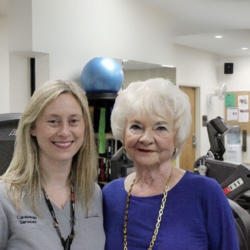 Jennifer Holder and Jo Ann Bickham standing in the cardiac rehab gym.