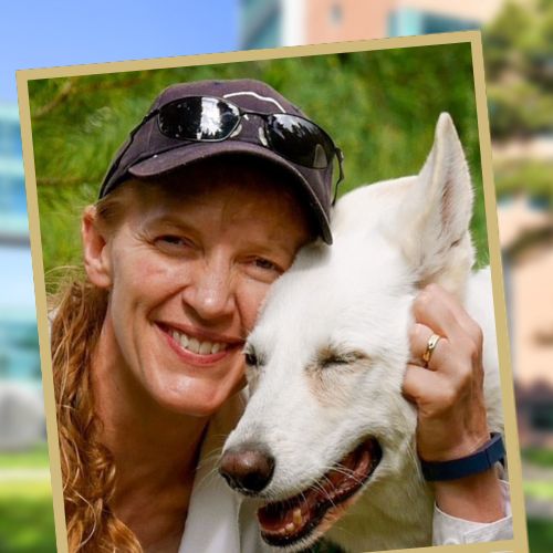 Portrait of the late Dr. Jennifer Turner-Valle with her white dog.