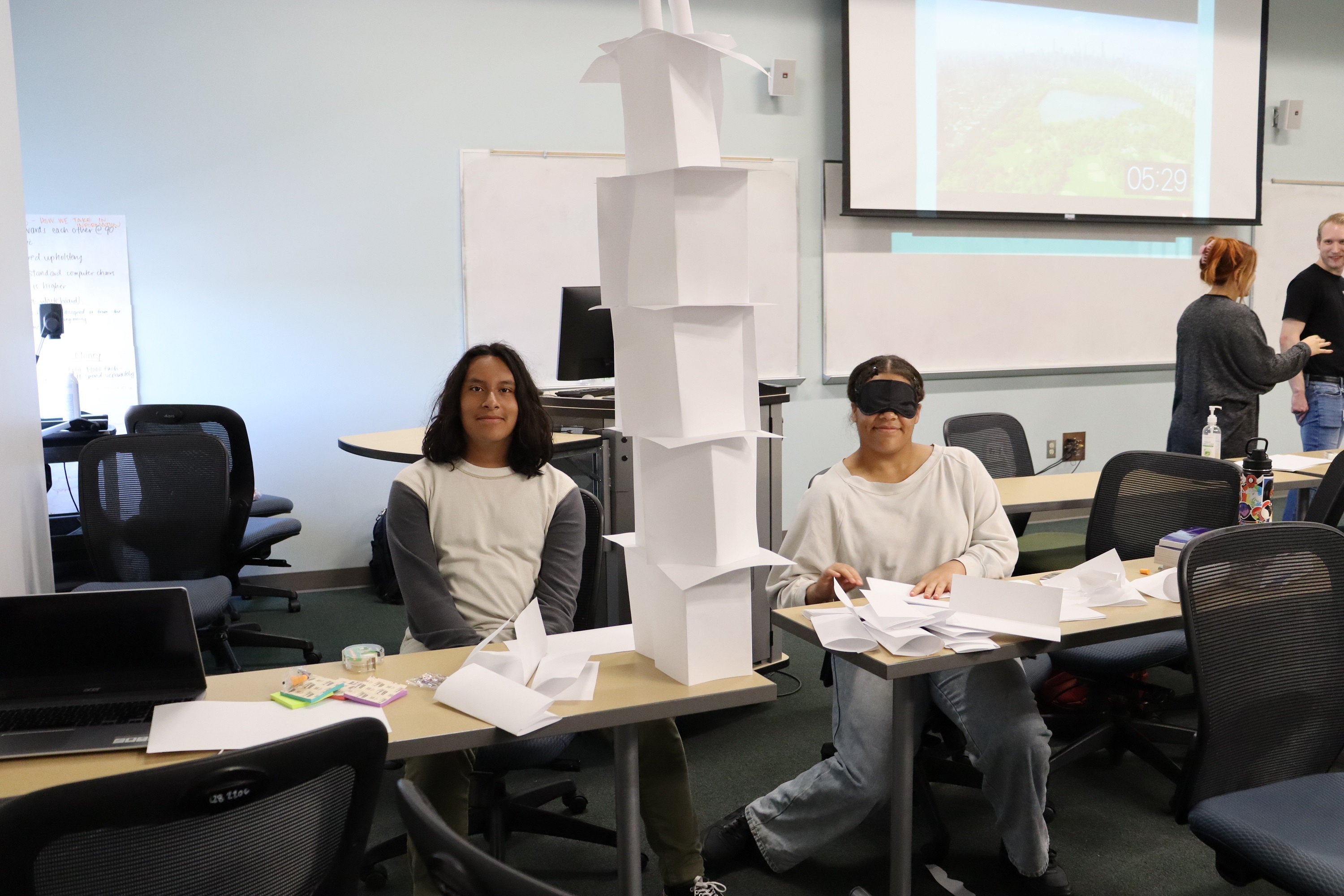 CUPS Summer Program Students participating in a hands-on paper building activity at Saturday Academy