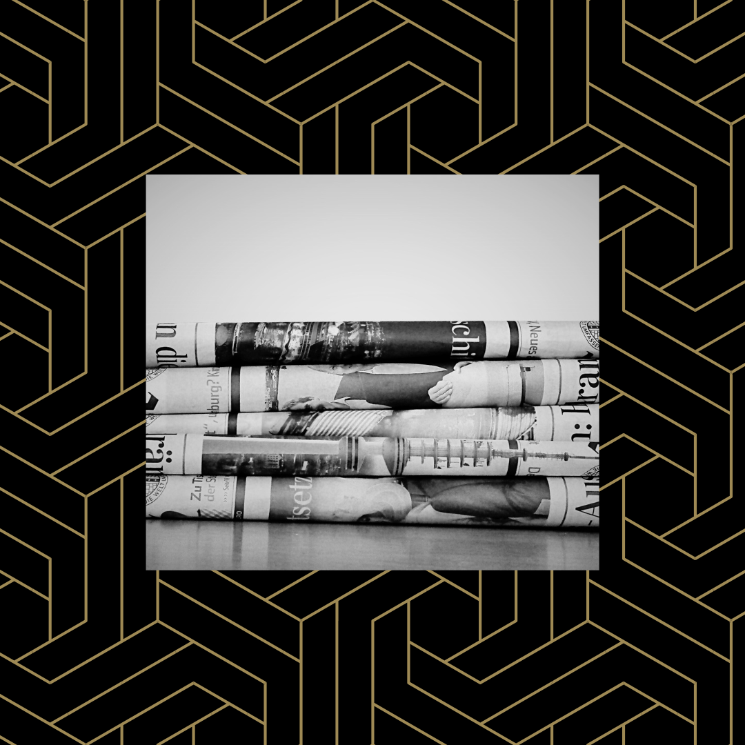 Black and white image of a stack of newspapers over a black and gold geometric background.