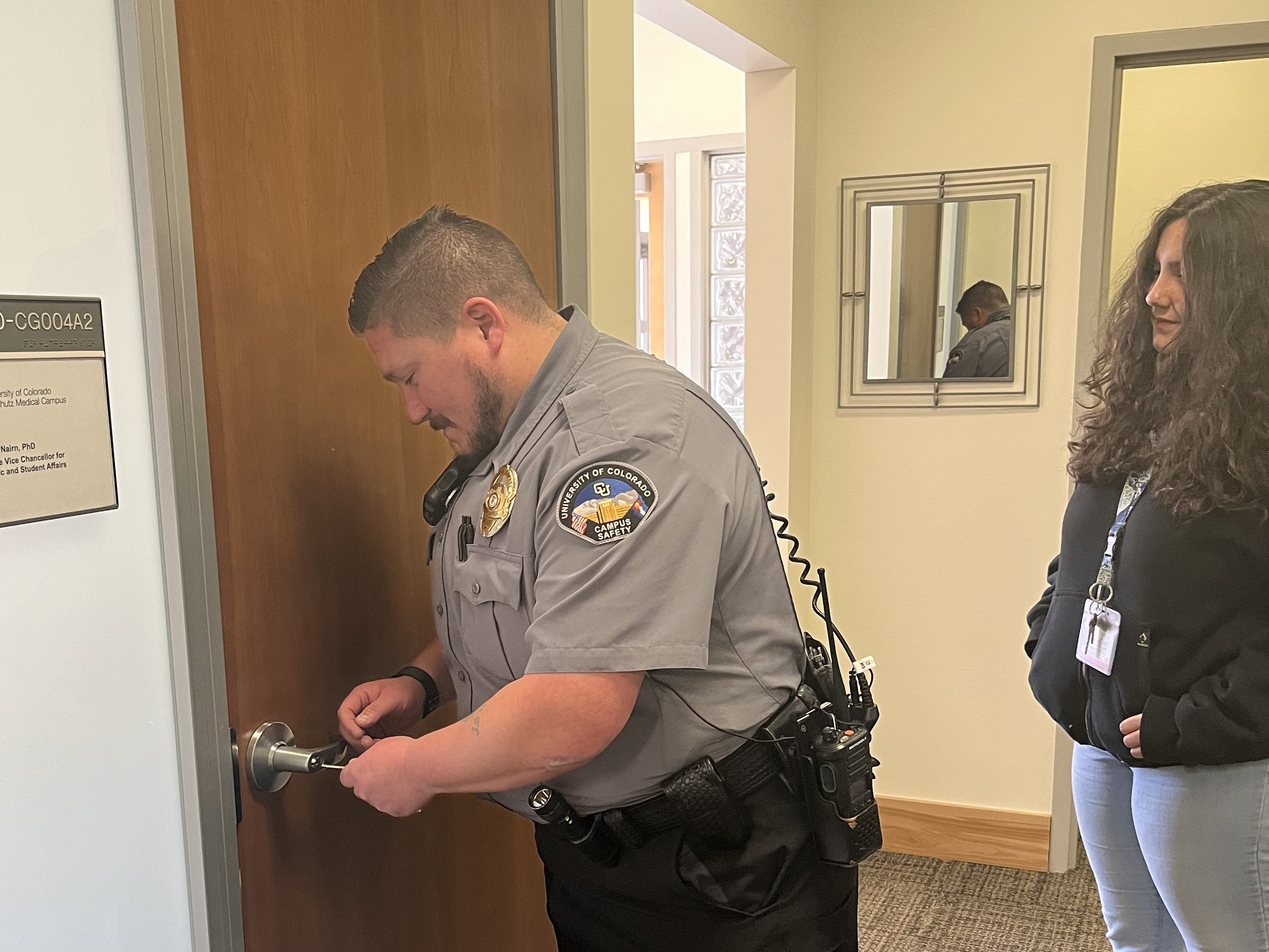 Security Guard Unlocking Door