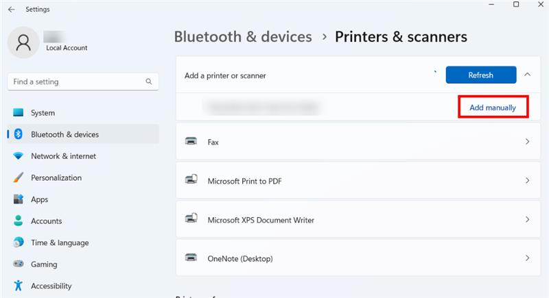Screenshot of the list of available printers, the specific printer name is blurred out for privacy, and the button to 