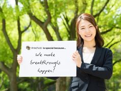 A women holds a sign that says